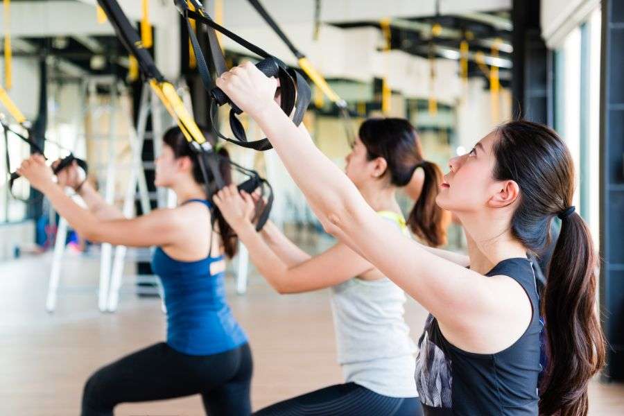 Pull-ups using a TRX